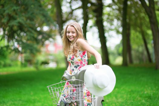 Young beautiful girl having a picnic in the countryside