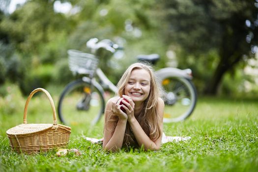Beautiful young girl spending her time in the countryside