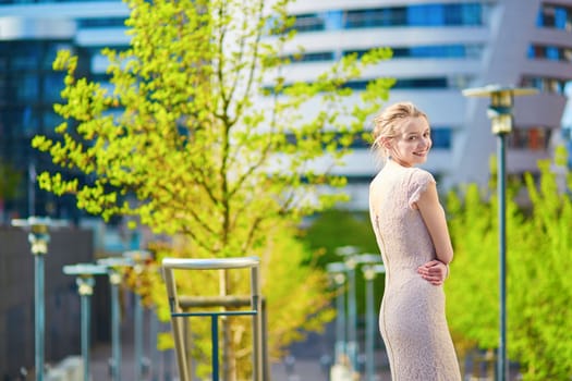 Beautiful young woman outdoors on a spring day