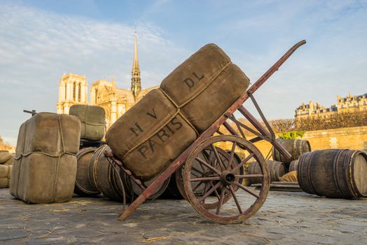 Docks of Notre Dame Cathedral in Paris with old barrels, France