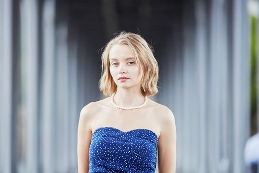 Beautiful young elegant French woman in Paris outdoors