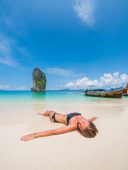 Beautiful woman on the beach of Poda island . Thailand.