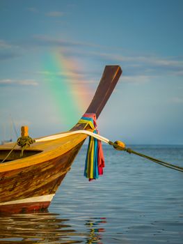 Long tailed boat Ruea Hang Yao in Phuket Thailand with rainbow