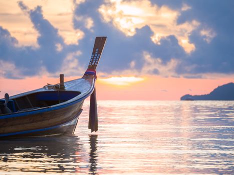 Long tailed boat  Ruea Hang Yao at sunrise in Phuket Thailand