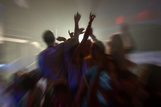 dancing people radial blur effect in Laganas Zakynthos Greece