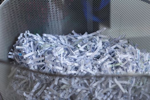 Shredded office paper in a basket