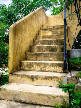 House frontyard cultured veneer stone work siding and rod iron stairs