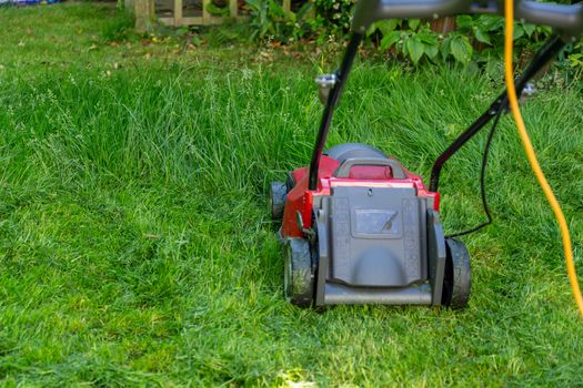 Mowing a household garden lawn