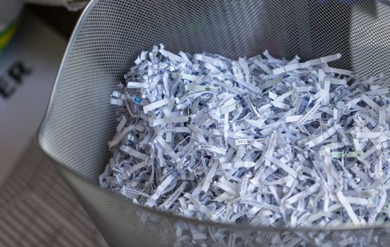 Shredded office paper in a basket