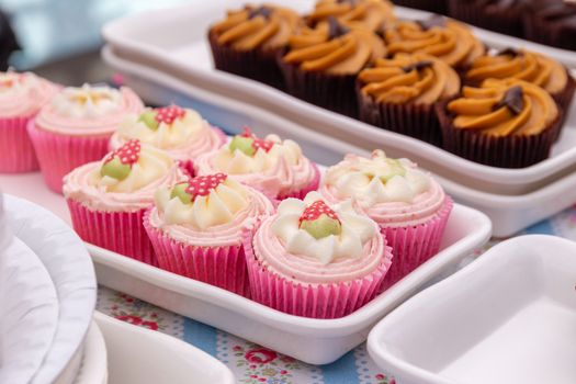 Homemade strawberry cupcakes on a market stall