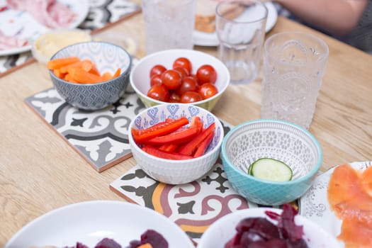 Bowls with salad ingredients on table