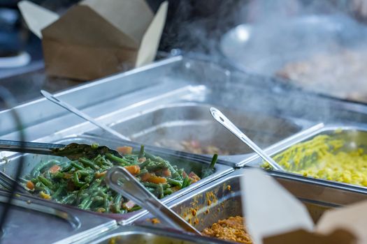 Hot takeaway food for sale on a market stall