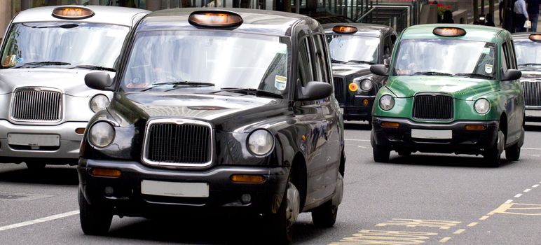 Five London Taxi Cabs