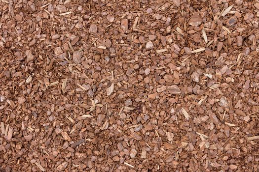 A background image of wood chip used for safety in toddlers playgrounds