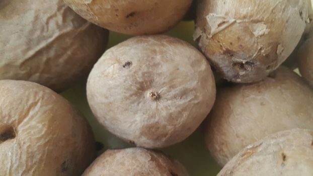 close up view of fresh organic potato in market:  Food background texture of raw potatoes