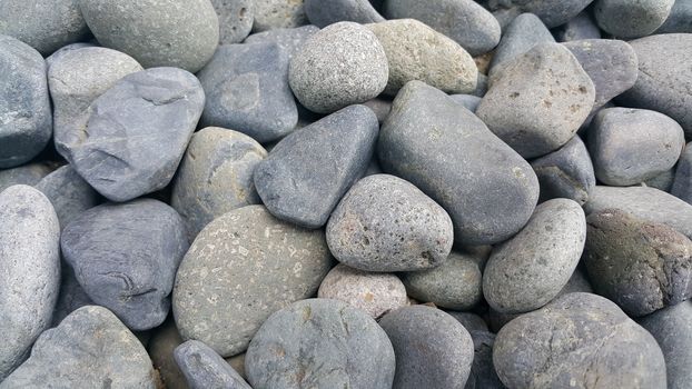 Texture background: Rock Pebbles, small, rounded, smooth pibbles with copy space for text
