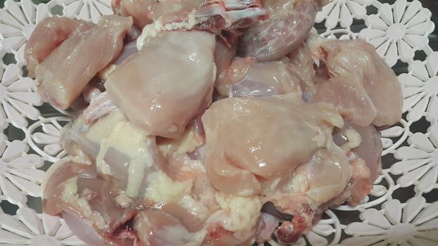 Chicken meat: Close up view of raw, fresh, choped and sliced chicken meat in grocery store use for food and ingredient background. 