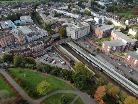 a drone shot of Exeter City centre in Devon , UK, showing Exeter Central station and the Rougemont Hotel.