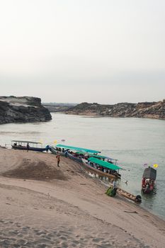 Longtail boat, Berth at sand Sam Pan Bok Grand Canyon in Maekhong river, Northeast of Thailand.