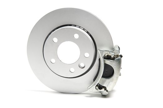 brand new brake discs, brake caliper and brake pad set for car. isolated on white with copy space