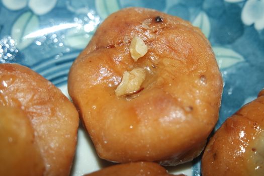 Closeup of delicious and tasty Asian sweet dish called balu shahi or baloshahi or balushahi. This dish is street sweet found in Pakistan India and Bangladesh and served in the festivities.