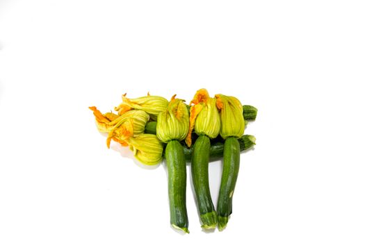 Arrangement of courgettes (zucchinis) on a white background