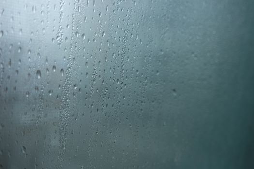 Bright grey color glassy texture, with water drops on it. Water drop glassy background