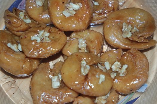 Closeup of delicious and tasty Asian sweet dish called balu shahi or baloshahi or balushahi. This dish is street sweet found in Pakistan India and Bangladesh and served in the festivities.