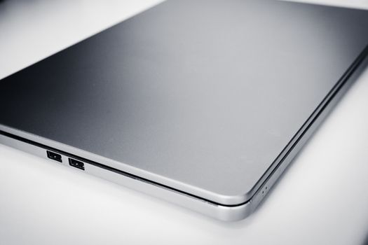 Stylish modern metallic laptop on a white background