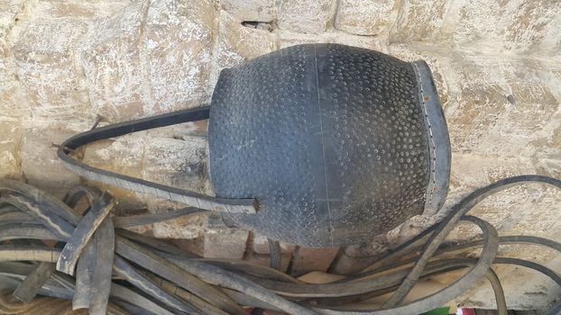 Closeup of hanging leather water bags made from automobile tires recycling. This leather water bad is called mashkeeza and used in olden days for carrying water in desserts