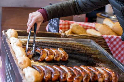 Sausages being cooked on a market stall