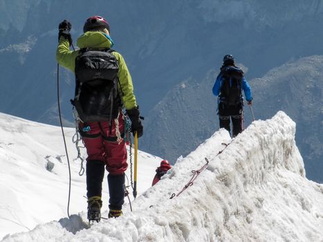 Trekkers on Aiguille Du Midi, in the french alps