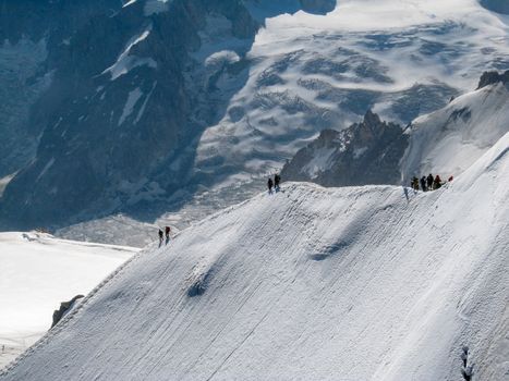 Trekkers on Aiguille Du Midi, in the french alps