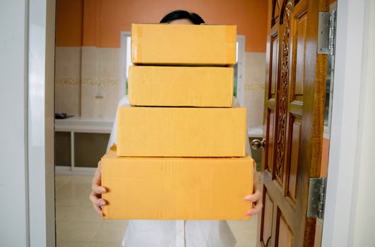 Delivery staff uniform handing a parcel box receiving parcel from delivery