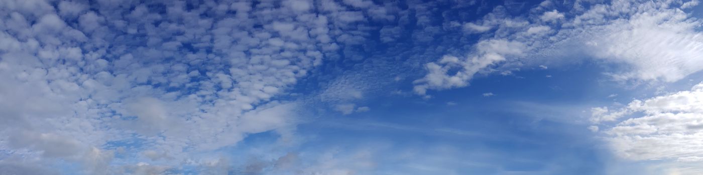 Vibrant color panoramic sky with cloud on a sunny day. Beautiful cirrus cloud. Panorama high resolution photograph.