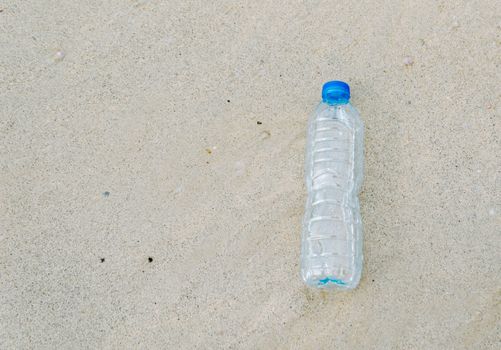 Plastic bottle garbage on the beach Human waste dumping