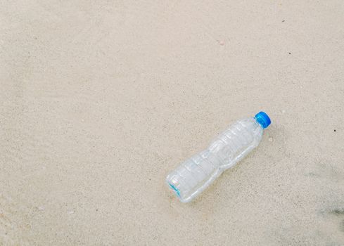 Plastic bottle garbage on the beach Human waste dumping