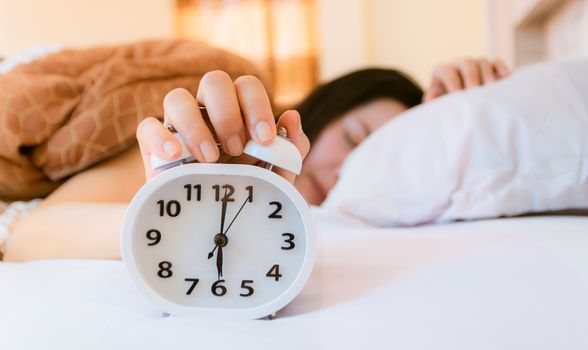 Alarm clock that wakes up in the morning in the bedroom