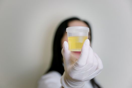 Urine tests sample analysis for doctor taking test tube with