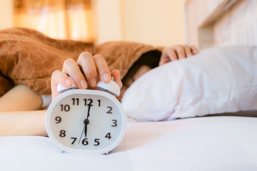 Alarm clock that wakes up in the morning in the bedroom