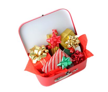 A red suitcase full of Christmas Presents isolated on white. Shot from a high angle.