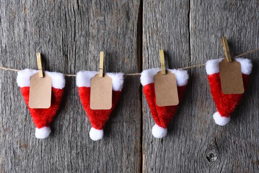 Advent Calendar made of Santa hats clothes pins and string.