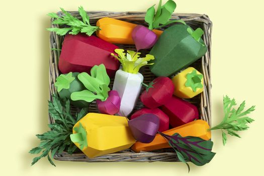 Colorful set of paper vegetables in tray wicker from paper tubes. Real volumetric handmade paper objects. Paper art and craft