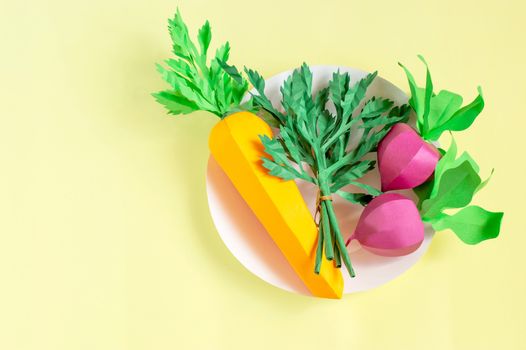 Colorful paper carrot, radish and parsley on paper plate. Real volumetric handmade paper objects. Paper art and craft