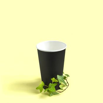 Eco-friendly disposable paper cup with green plant branch. Use paper disposable utensils instead of plastic, zero waste. Concept of social responsibility and environmental protection