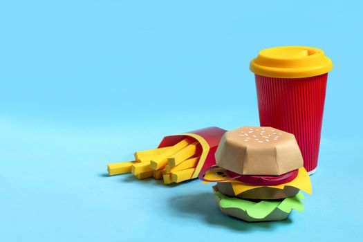 Handmade paper hamburger, french fries in box and drink in paper cup. Paper art and craft. Real volumetric handmade paper objects