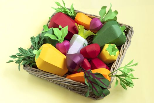 Colorful set of paper vegetables in tray wicker from paper tubes. Real volumetric handmade paper objects. Paper art and craft