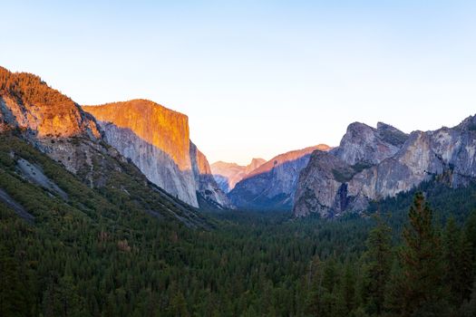 Yosemite valley nation park during sunset view from tunnel view on twilight time. Yosemite nation park, California, USA. Panoramic image.