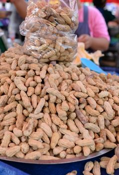 Many hard-boiled peanuts in a basin for sale