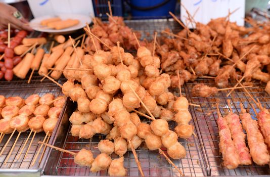 meatballs, crab sticks, top chicken wings, hot dog, pork top, fried batter, Thai fast food.